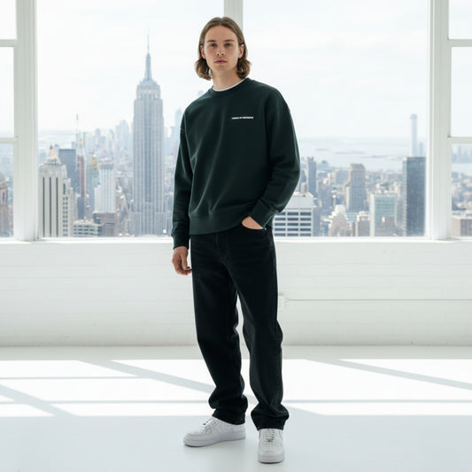 Black sweatshirt with white chest logo on male model in studio