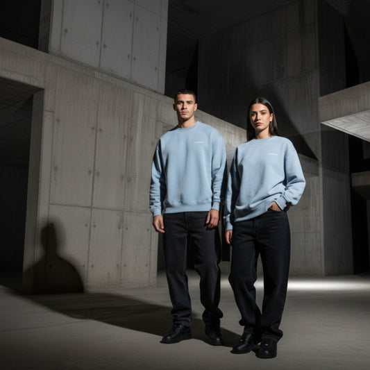 Blue sweatshirt with small white chest logo on both male and female model
