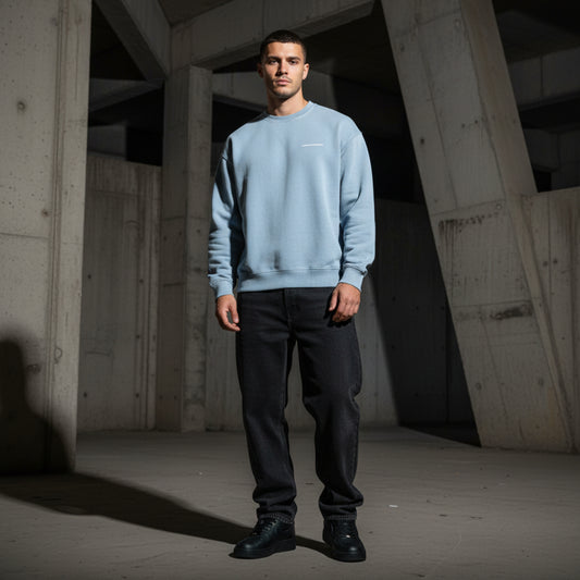 Light blue sweatshirt with a small white logo on male model