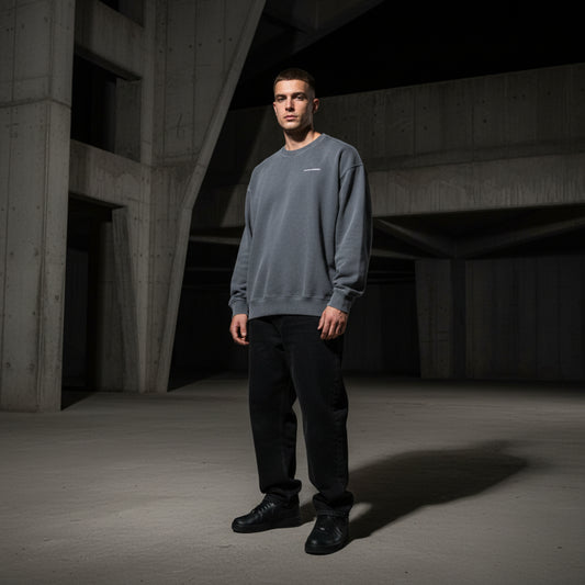 Gray sweatshirt with a small white logo on male model