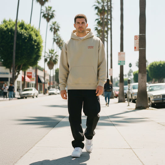 Clay hoodie with red text on chest on male model in LA